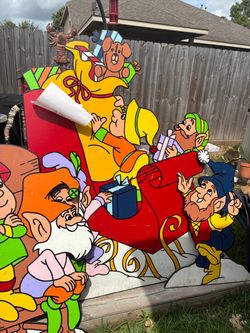 Wooden yard Christmas sleigh with elves