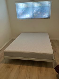 Full Size Mattress with White Metal Bed Frame