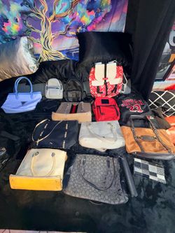 Lot of brand new/ barely used purses/ men’s bags  hit me up with questions on prices or $450 obo takes all of them