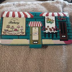 This item is a Shagwear brand "Bakery & Flower Shop" wallet, 