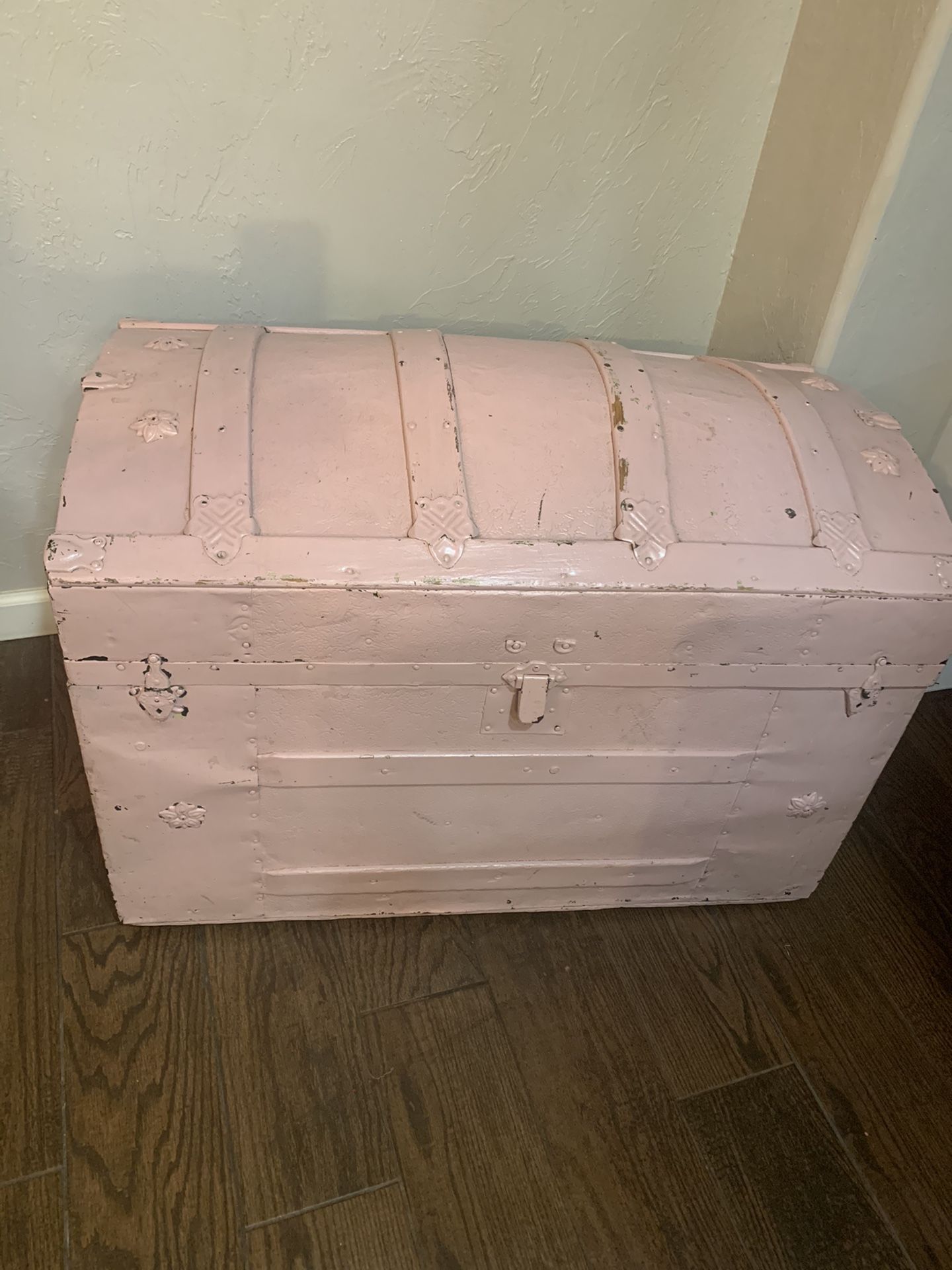 Antique trunk with wheels