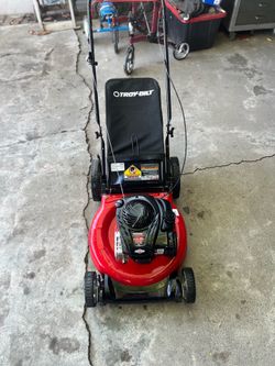 a Troy-Bilt 21-inch gas-powered push lawn mower