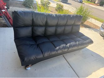 Couch turns into futon bed