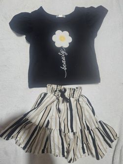 Black & white striped girl outfit with white flower graphic and 'beauty' text size 7