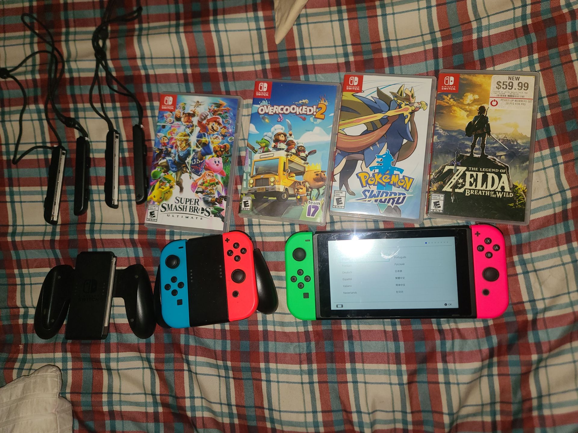 Nintendo switch, 4 joycons/2 joy-con Grips, 4 games $200