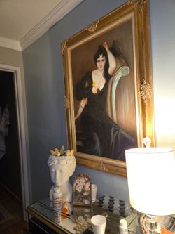 Girl in a black dress painting