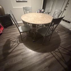 Marble round table with four chairs