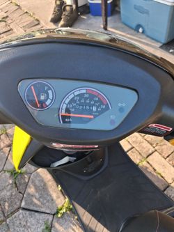This scooter is a neon green 2024 Italica strada 50cc