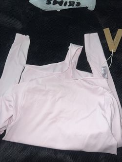 SKIMS (PINK BODY SUIT)