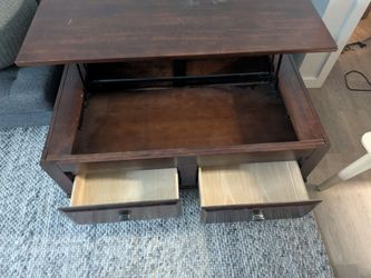 Coffee table with lifting surface