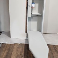 Iron-A-Way electric in wall folding ironing board center.  Model E42