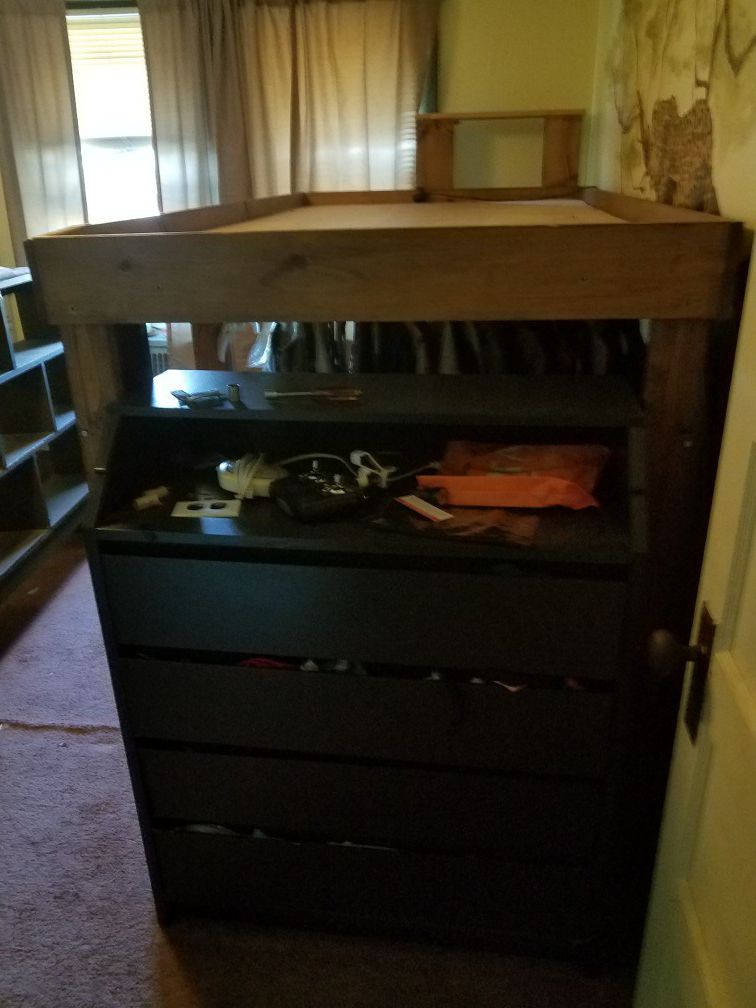 Custom made twin loft bed. Has pole under to hang clothes, ladder and shelf. Dresser not included.