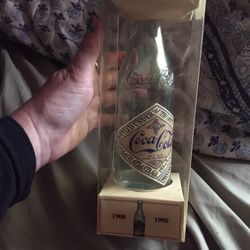 Coca-Cola bottle and display case