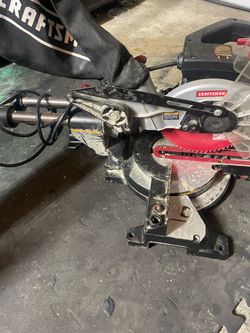 Sliding saw with a laser