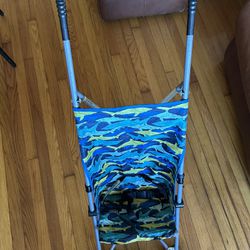 Cosco Umbrella Stroller With Blue Sharks On It