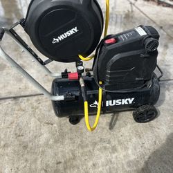 8 Gallon Husky Air Compressor & husky Hose Reel. FOR SALE!!!
