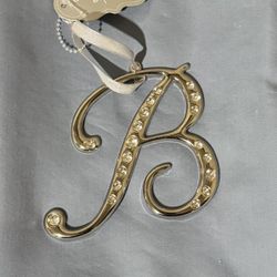St. Nicholas square diamond accented cursive B