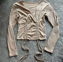 Tan ribbed long sleeve crop top with tie detail