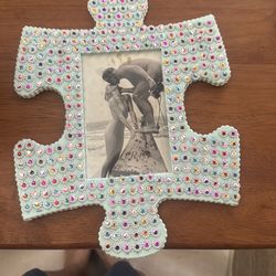 Cute picture of free love couple framed in plastic puzzle piece