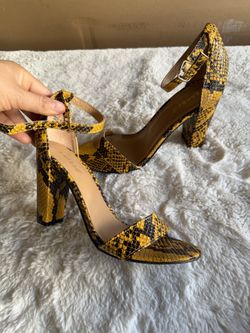 Woman’s Yellow & Black High Heel