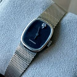 Vintage women's Longines manual-wind watch, 10-karat white gold-plated.