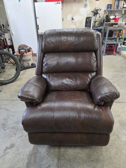 Brown leather recliner (rocker)