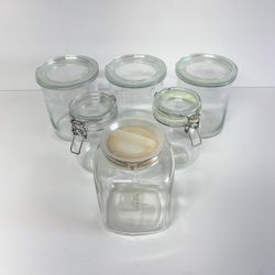 4 assorted glass kitchen jars and 1 glass pitcher