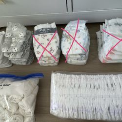 NEW! 135 Size 1 and size 2 diapers - Huggies, Honest, Coterie, Kirkland, Mama Bear