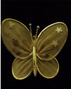 Gold tone butterfly mesh pin