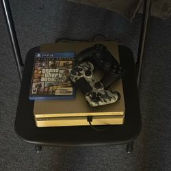 PS4 With 2 Controllers And Grand Theft Auto 