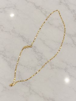 A yellow-gold diamond-cut cable chain necklace