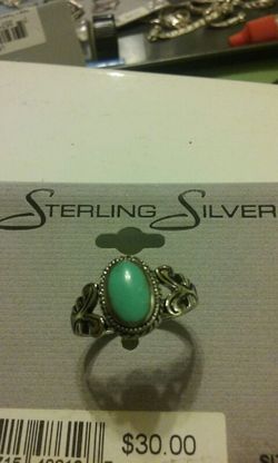Sterling silver ring with green stone.