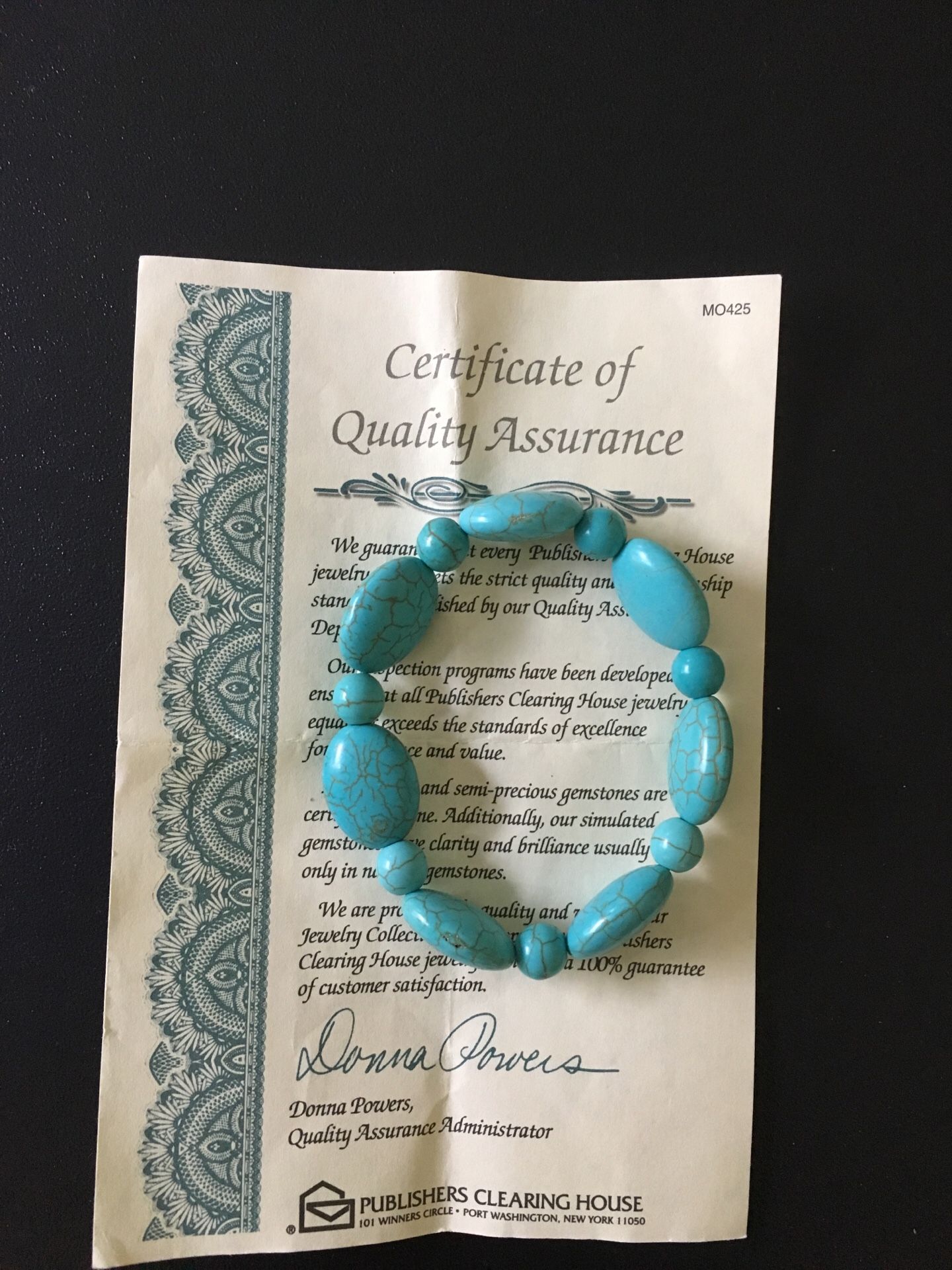 turquoise bracelet. Dana power design. came with paper certificate