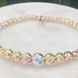 18k solid gold bracelet, yellow, white and rose gold , 9 grams weight