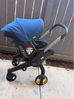 Doona stroller with navy blue canopy