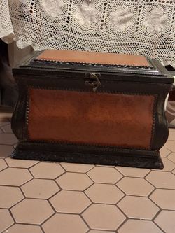 Antique chest leather and wood.