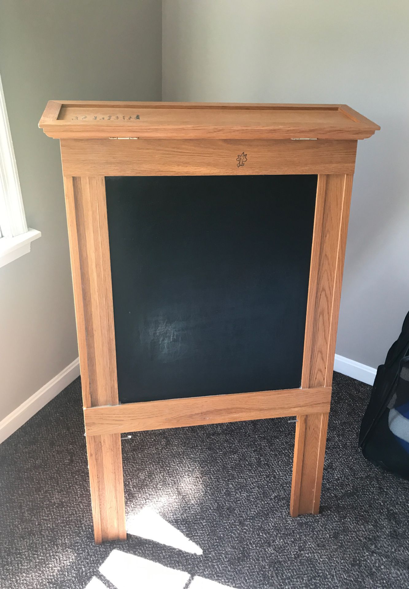 Chalk board or side /dry eraser the other. Store markers in top lid