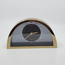 Vintage SEIKO QQZ137G Half Moon Gold Black Desk Mantle Clock Made in 
Japan. Pre-owned, in good working and cosmetic shape. Tested, works.
Battery is 