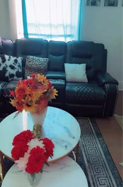 Black Leather Recliner Sofa with Console and a marble table