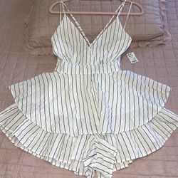 AKIRA ROMPER, Size Large but runs small like a size medium, new with original tags. Adjustable straps and zipper in the back.