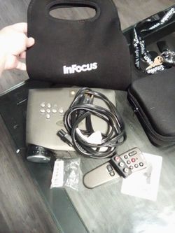 In Focus movie projector and screen