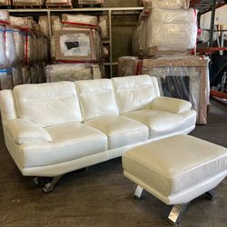 White Leather Sofá with Ottoman Rooms To Go Sofia Vergara couch