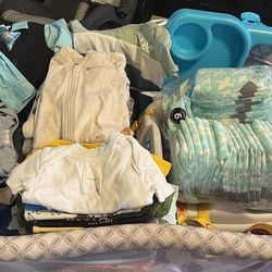 Bed Side Crib And Baby Clothes 