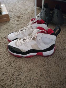 White, black and red youth Jordans