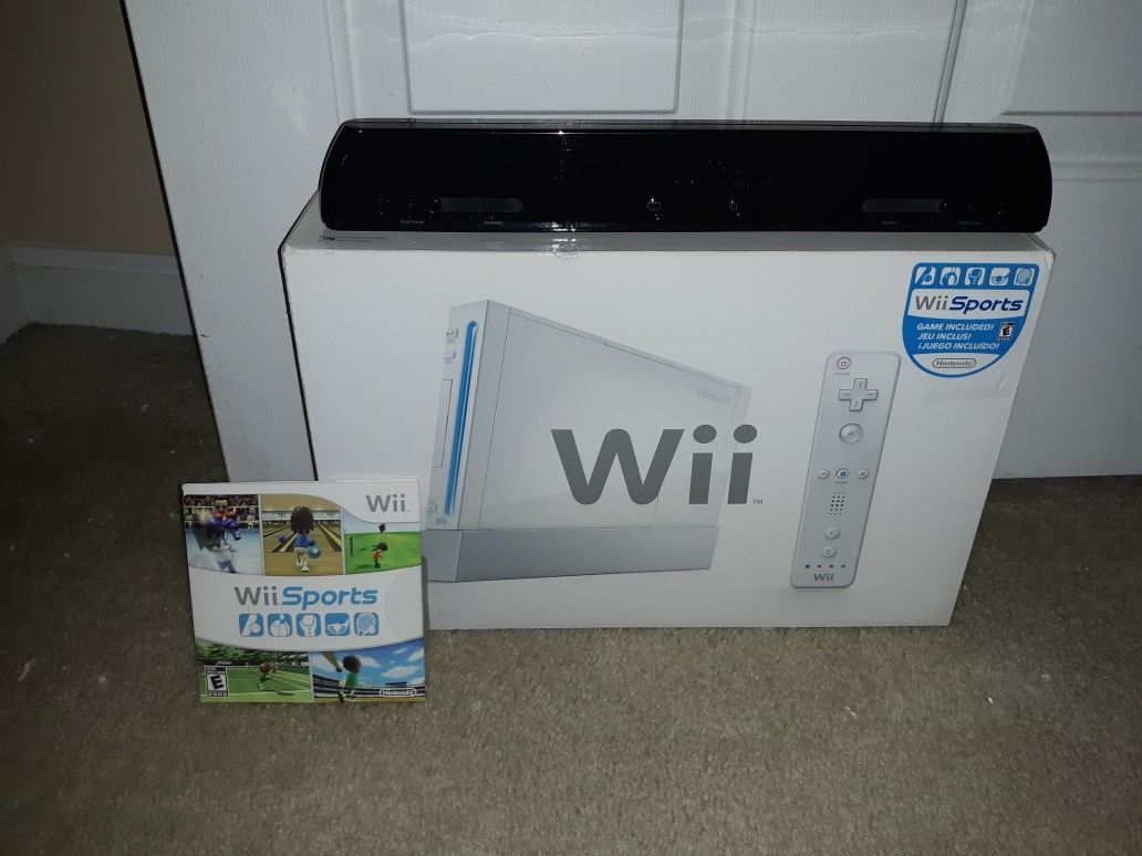 Complete in box White Wii with wireless wii sensor and wii sports