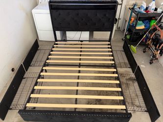 Barely used queen frame with 4 roll out drawers