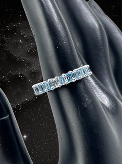 Blue emerald diamond shape eternity band in gold