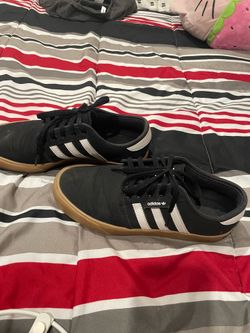 black adidas with brown rim