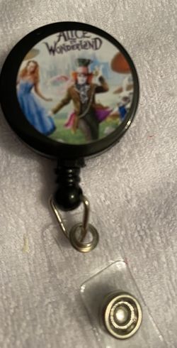 Alice in wonderland with the mad hatter badge reel