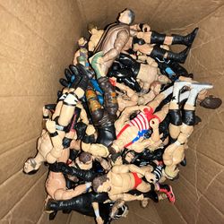 A large array of many WWE action figures toys Aew